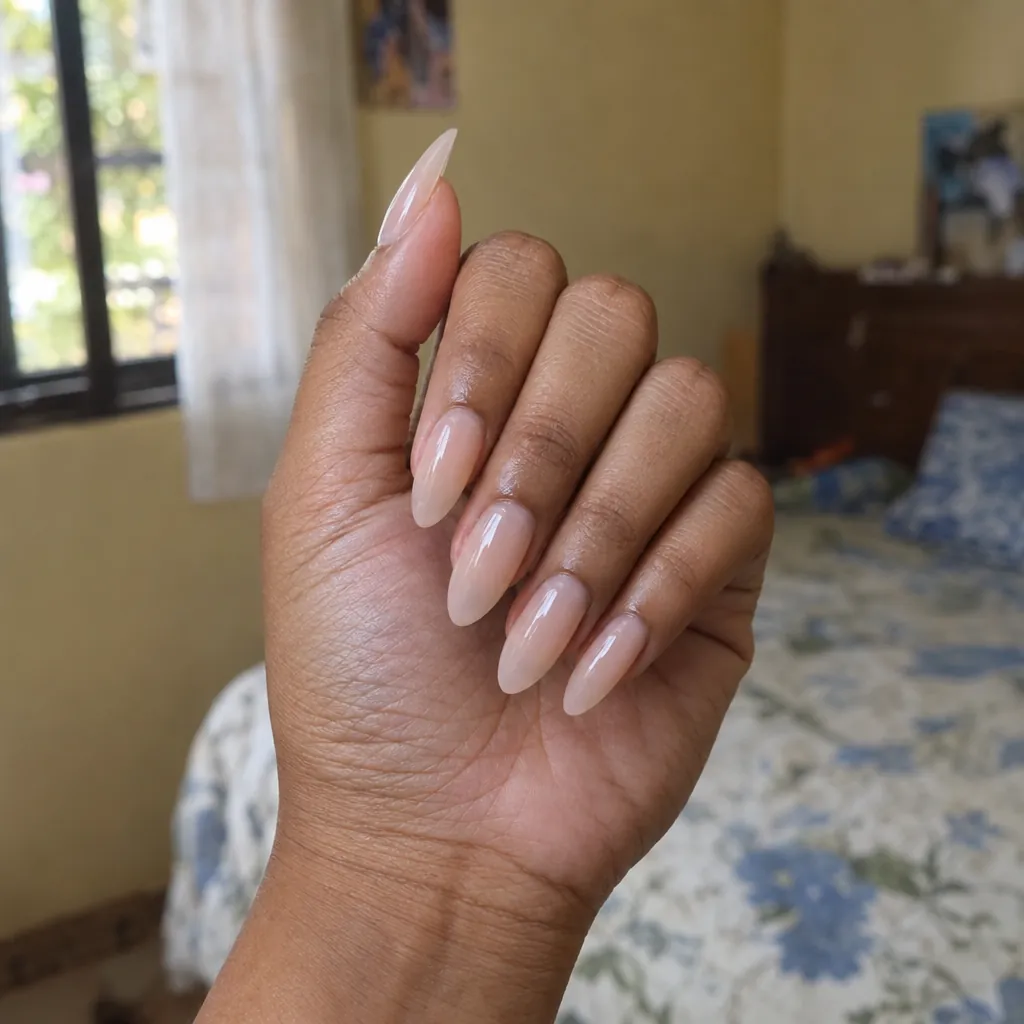Long almond soft gel extensions in a milky nude.